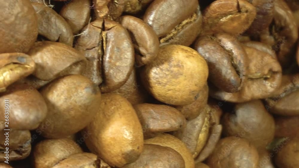 Seeds of coffee fall. Coffee beans. Coffee beans. quality of grain roasted coffee to spill in the bag , slow motion Seeds of coffee fall. Coffee beans. Coffee beans. quality of grain roasted coffee to spill in the bag , slow motion