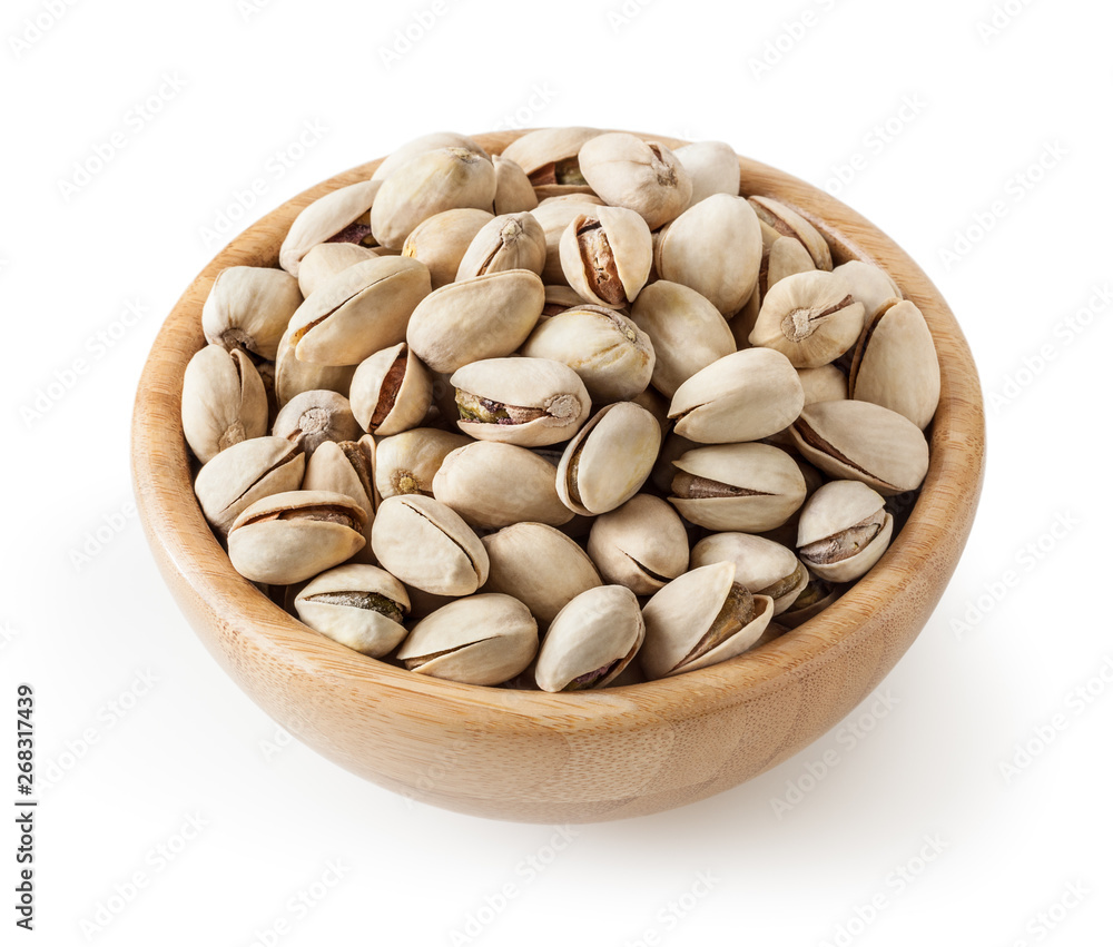 Salted pistachios in wooden bowl isolated on white background with clipping path Salted pistachios in wooden bowl isolated on white background with clipping path