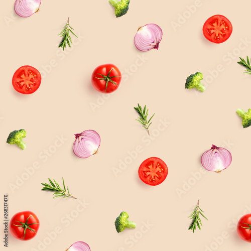 Fototapeta Naklejka Na Ścianę i Meble -  Creative pattern made of tomato, broccoli and onion on beige background. Flat lay. Food concept.