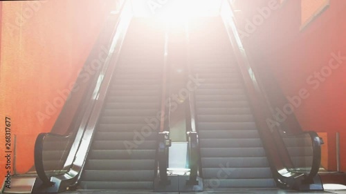 Bright White Light With Escalator Going Up And Down