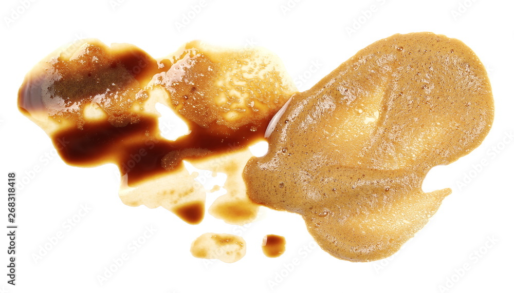 Spilled coffee with foam, stains isolated on white background, top view Spilled coffee with foam, stains isolated on white background, top view