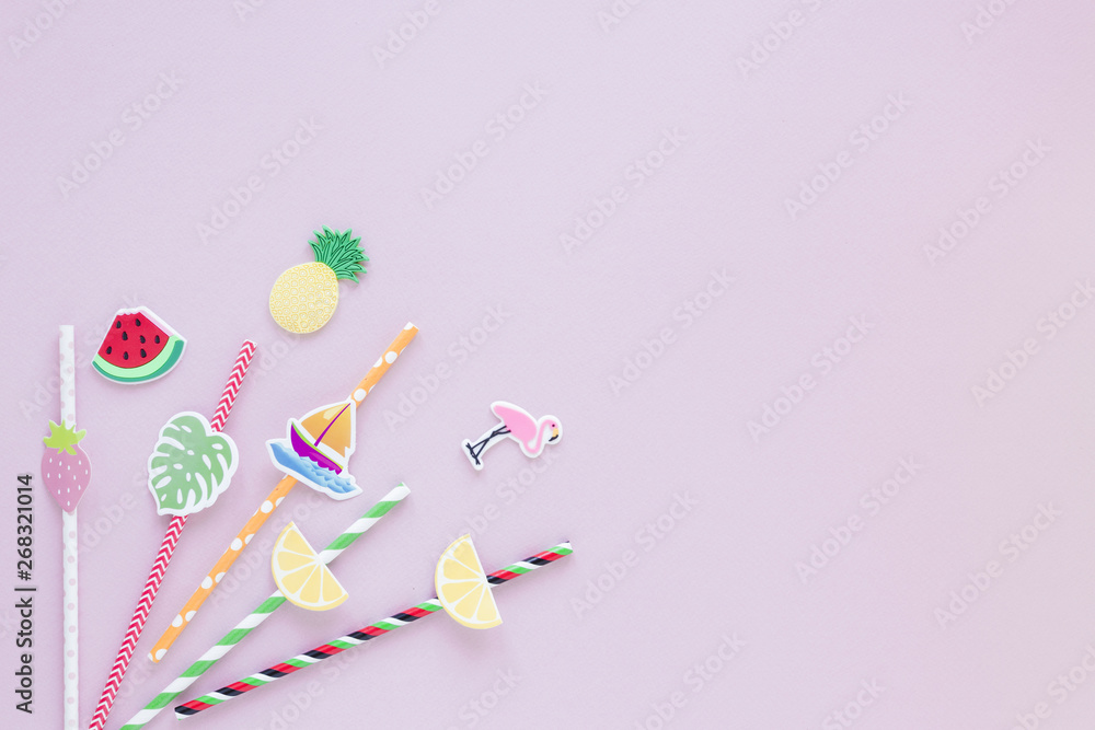 Different plastic straws on pink table Different plastic straws on pink table