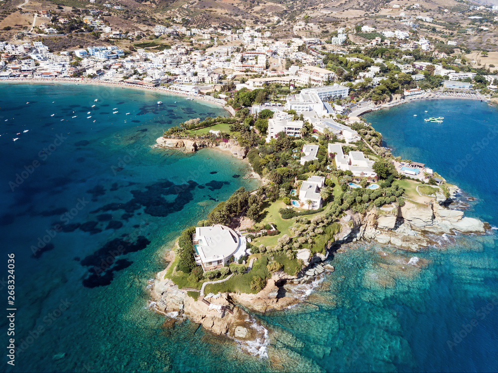 Aerial drone photo of beautiful cretan village by the sea