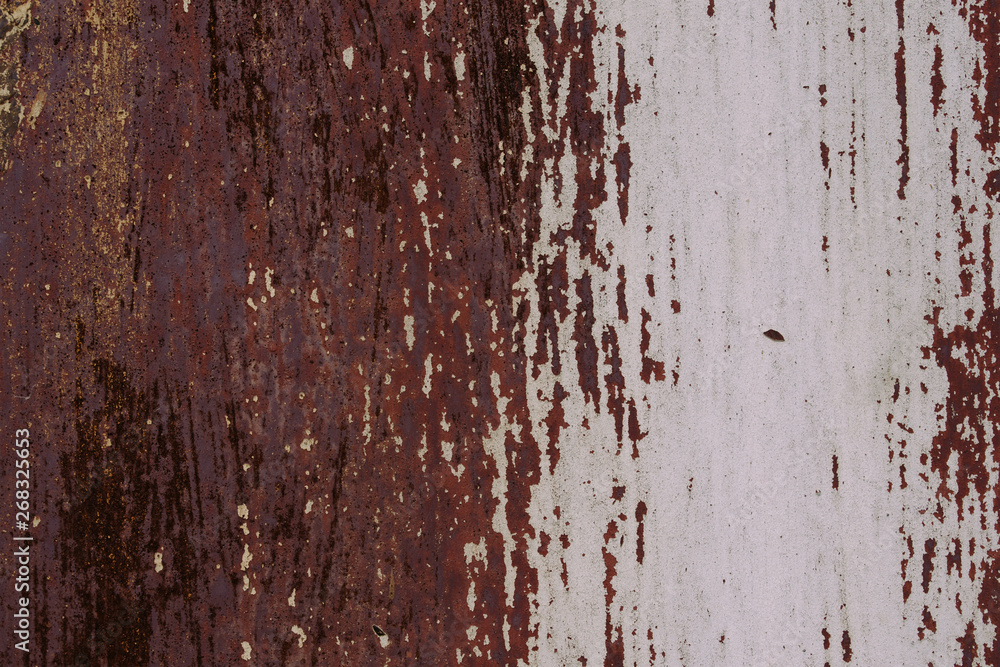 Abstract colorful wall texture and background. Close-up iron surface with old white and brown paint
