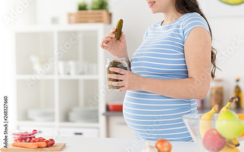 Принти на полотні pregnancy, food cravings and people concept - close up of pregnant woman eating