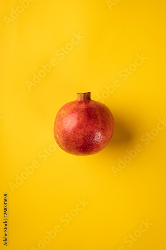 Pomegranate fruit, ripe, juicy, red pomegranate on a colored background