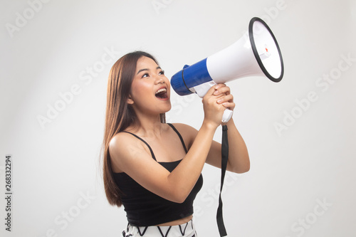 Beautiful young Asian woman announce with megaphone.