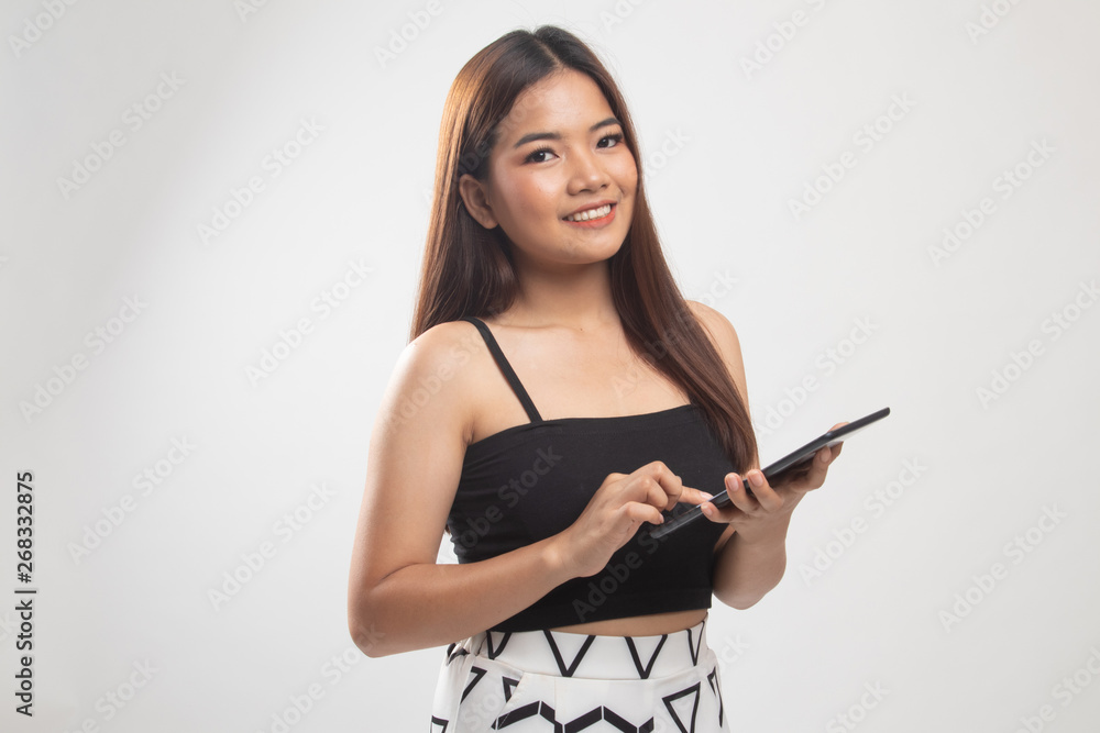 Young Asian woman with a computer tablet. Young Asian woman with a computer tablet.