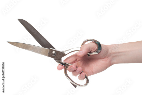 Hand holding big steel scissors, industrial tool