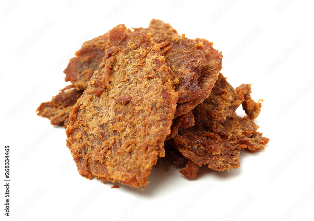 Slices of beef jerky on white background