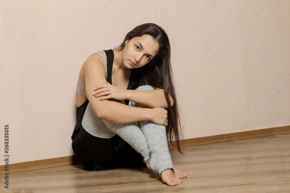 Beautiful girl dancer. tired girl dancer. girl ballerina or dancer is resting near the ballet barre in a dance studio after training. Beautiful girl dancer. tired girl dancer. girl ballerina or dancer is resting near the ballet barre in a dance studio after training.