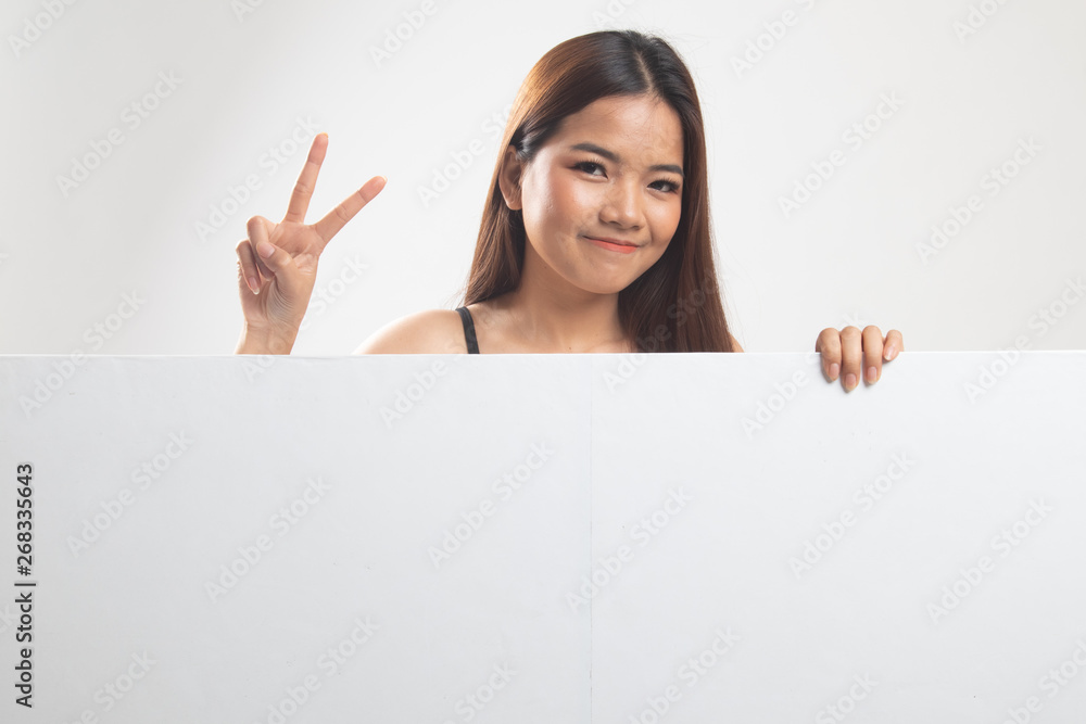 Young Asian woman show victory sign with blank sign. Young Asian woman show victory sign with blank sign.