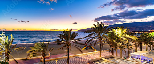 Panoramic view of Mediterranean beach promenade at sunset sunrise in Almeria, Spain.