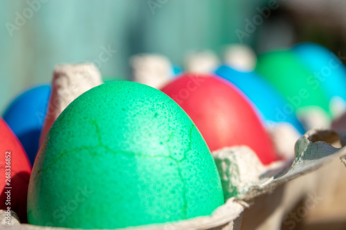 Green egg in wrapping easter holiday close up