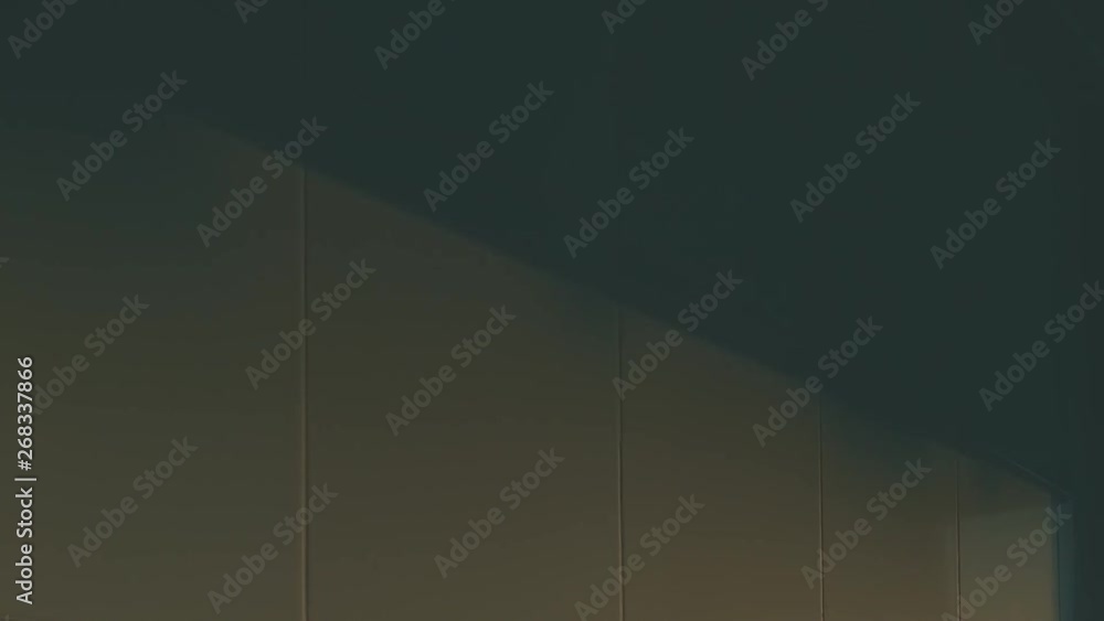 Timelapse of sunset in luxurious house. Patterns of the window frame create a breathtaking abstract gold view on the wall. Timelapse of sunset in luxurious house. Patterns of the window frame create a breathtaking abstract gold view on the wall.