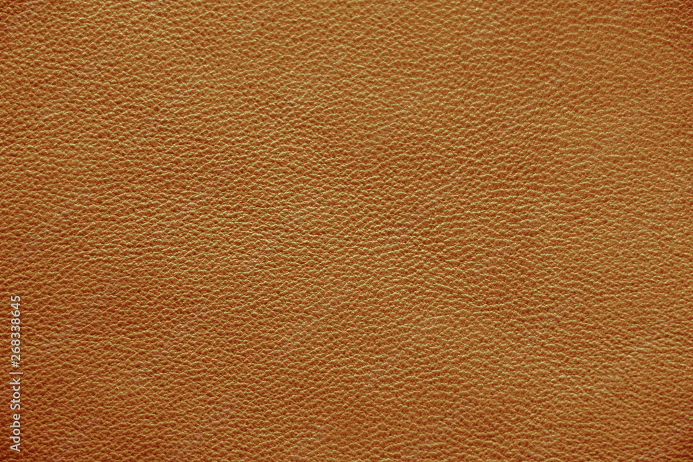 The texture of genuine leather. Impeccable and stylish background. Beautiful stylish background. Natural skin texture close up. Brown background. The structure of the leather material brown shades. The texture of genuine leather. Impeccable and stylish background. Beautiful stylish background. Natural skin texture close up. Brown background. The structure of the leather material brown shades.