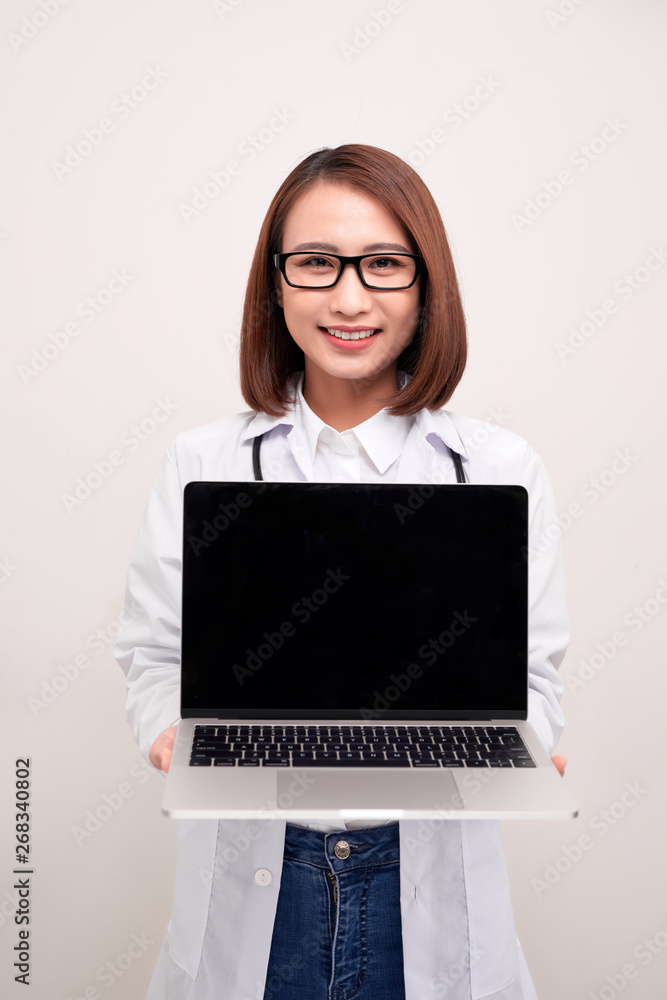 Doctor woma holding laptop on withe background Doctor woma holding laptop on withe background