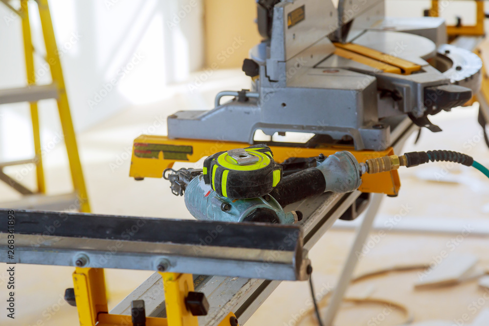 Construction site power tools cutting using circular saw. Working equipment carpentry