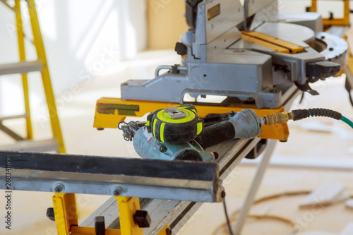 Construction site power tools cutting using circular saw. Working equipment carpentry