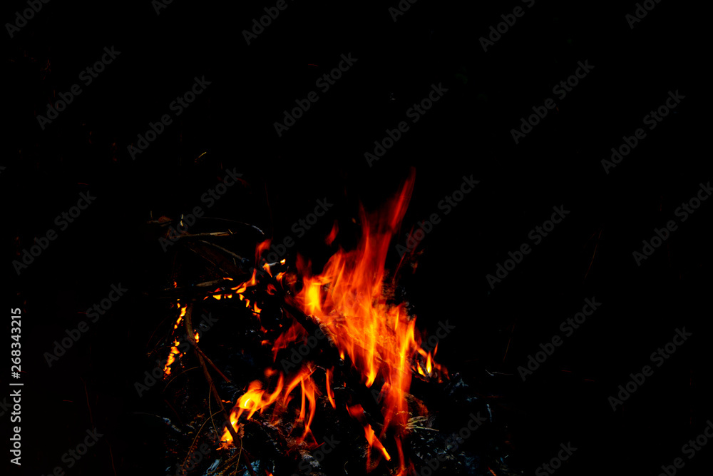 orange fire on black background orange fire on black background