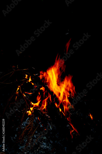 orange fire on black background © Theeranad