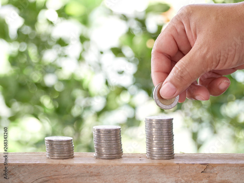 Cropped Hand Stacking Coins