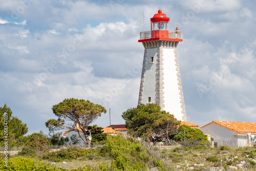 Lighthouse placed on the Cap Leucate over Mediterranean coast of Aude Department, southern France. A popular holyday destination of the Amethyst Coast where to practice Surfing or Diving.