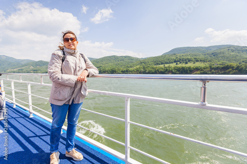 Happy tourist woman enjoy view of Danube river at cruise ship © mitarart