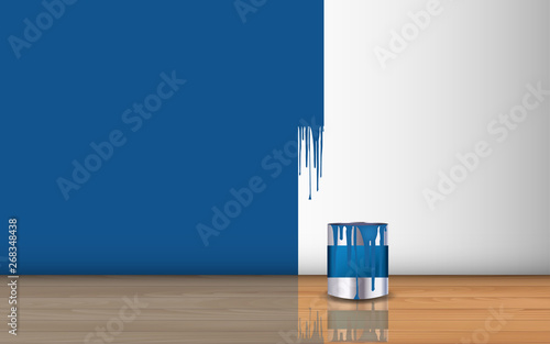 blue paint on the wall and paint bucket on the wooden floor