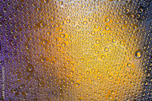 Condensate. Drops of water on a glass. Multicolor.  