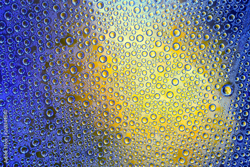 Condensate. Drops of water on a glass. Multicolor.  