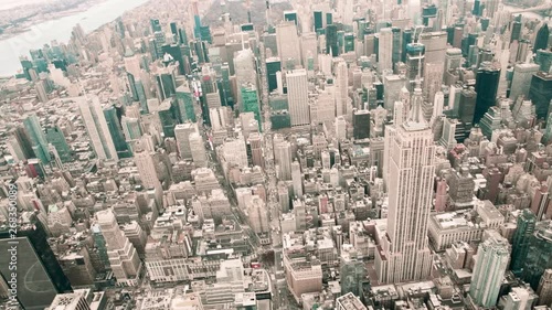 NEW YORK CITY - DECEMBER 3, 2018: Aerial view of Empire State Building from helicopter in slow motion. This is a major city icon