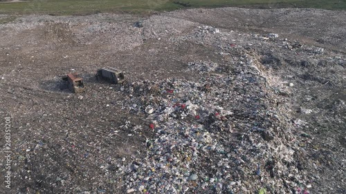 Wallpaper Mural environmental pollution problem, drone view on people work at a dump near trucks and flying seagulls over large rubbish pile Torontodigital.ca
