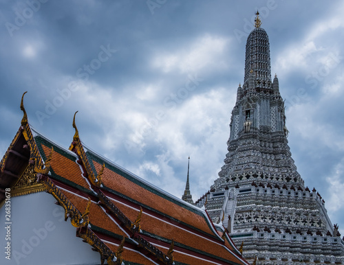 tipical thai architecture roof top with wat arun on the back