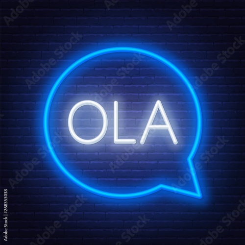 Neon sign of word Ola in speech bubble frame on dark background. Greetings in Portuguese. Light banner on the wall background.