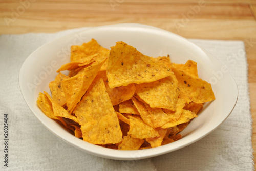 Cheesy Tortilla Chips Served ina White Bowl 