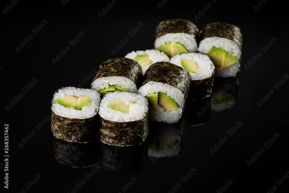 Sushi Roll - Maki Sushi pieces collection with Salmon Roe, Smoked Eel, Cucumber, Cream Cheese, Sesame, Avocado, Onion Fries, Crab Meat, Tobiko isolated on black background - Image Sushi Roll - Maki Sushi pieces collection with Salmon Roe, Smoked Eel, Cucumber, Cream Cheese, Sesame, Avocado, Onion Fries, Crab Meat, Tobiko isolated on black background - Image