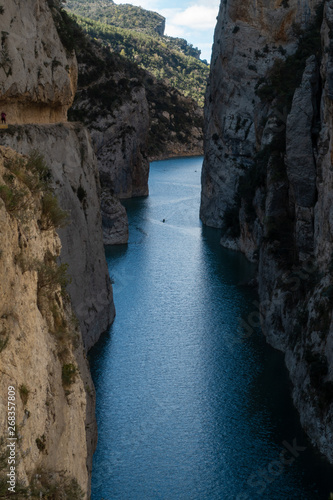 Cliff between river with kayak sailing