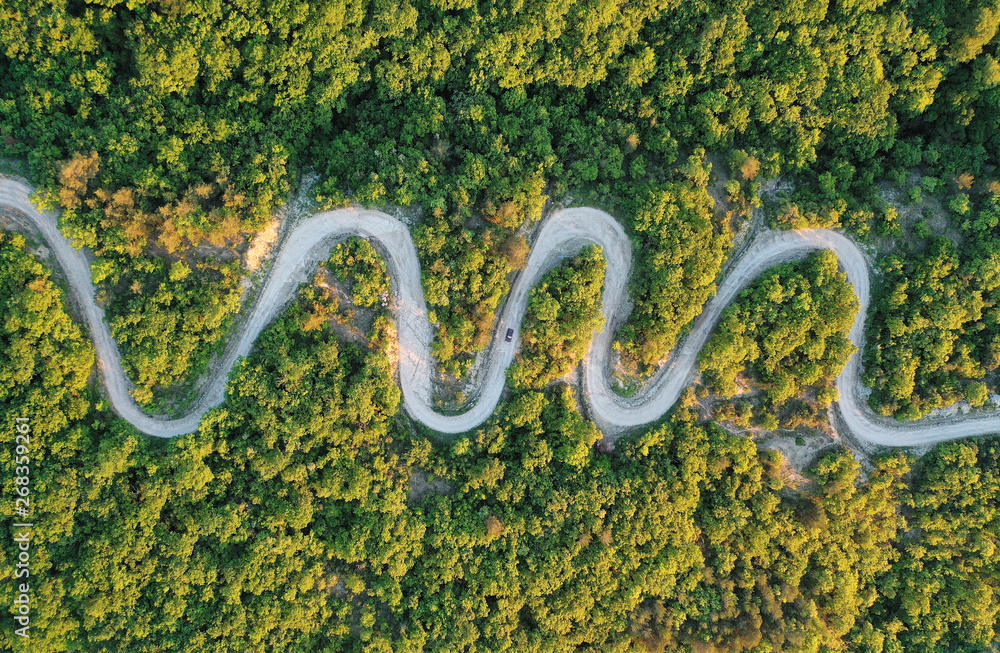 Road trip, car going through a curve road. Road trip, car going through a curve road.
