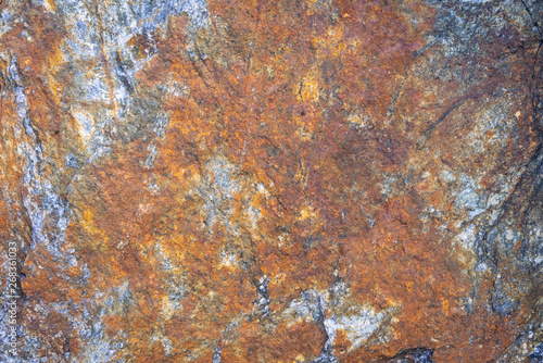 Rusty texture. Stone rusty background. Colorful granite stone background. Old Cracked Rusty Rough texture. Rock wall backdrop with rough red brown texture. Grunge Abstract Stone Surface. 
