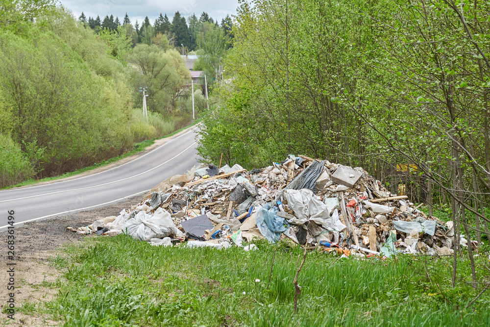 Pile of garbage lying on the roadside of russian countryside road Pile of garbage lying on the roadside of russian countryside road