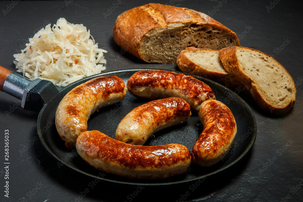 five tasty ruddy meat wieners fried in large frying pan five tasty ruddy meat wieners fried in large frying pan