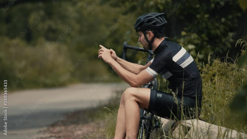 Cyclist In Helmet Take Picture On Mobile Phone.Athlete Taking Photo.Cyclist Taking Photo With Smartphone During Biking Cycling.Portrait Bicyclist Taking Photo.Bicyclist Photographer.Athlete Smartphone Cyclist In Helmet Take Picture On Mobile Phone.Athlete Taking Photo.Cyclist Taking Photo With Smartphone During Biking Cycling.Portrait Bicyclist Taking Photo.Bicyclist Photographer.Athlete Smartphone