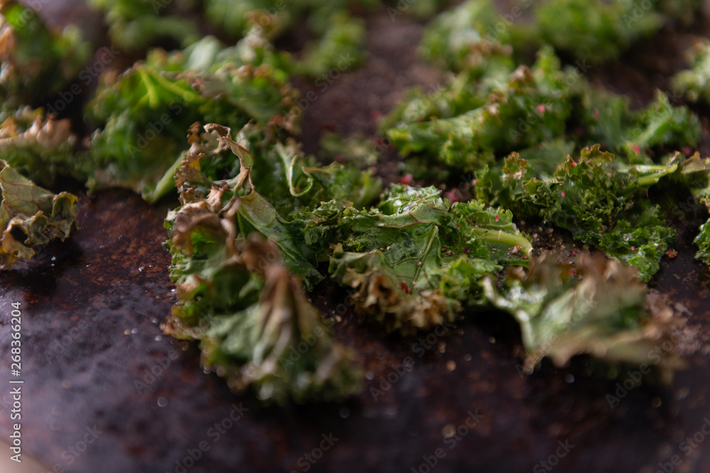 Organic Kale Being Baked on Stainless Steel Cookie Sheet Organic Kale Being Baked on Stainless Steel Cookie Sheet