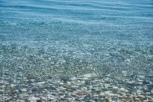 Blue sea and pebbles background