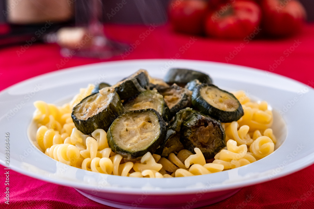 Italian food: pasta with zucchini and parmesan