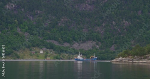 Wallpaper Mural Coaster sailing in Fjord, dissapearing behind island Torontodigital.ca