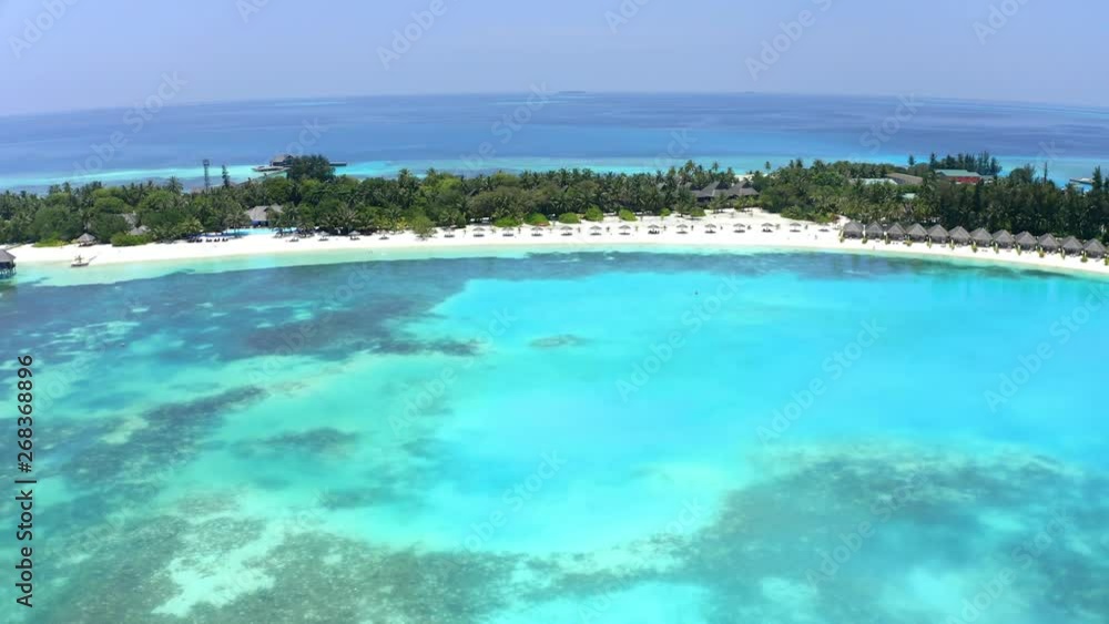 Aerial view, flight at island Olhuveli with Waterbungalows, South Male Atoll, Maldives Aerial view, flight at island Olhuveli with Waterbungalows, South Male Atoll, Maldives
