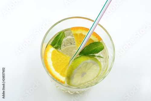 Glass of drink with citrus juice