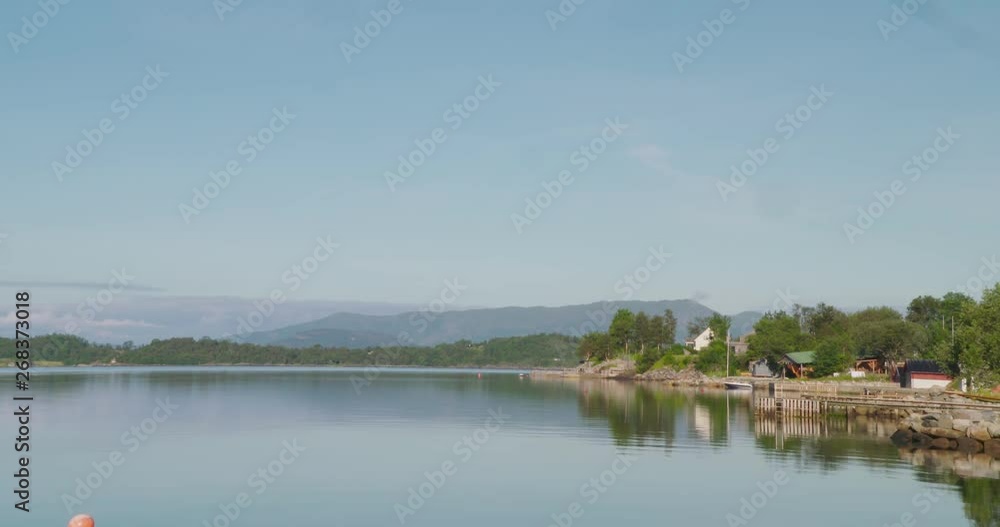 wide shot coast of a fjord on a sunny day wide shot coast of a fjord on a sunny day